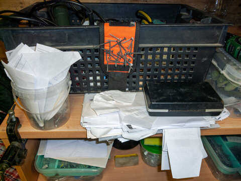 checks in a messy work studio