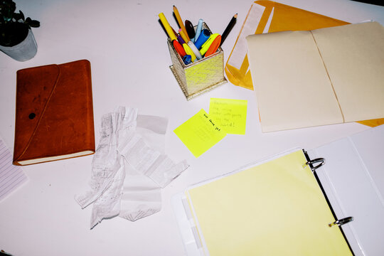 messy ugc lo-fi direct flash of office mess receipts and paperwork