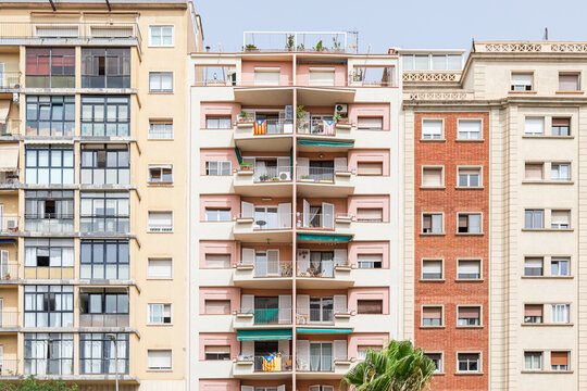 Tall peach-colored condominium buildings with balconies