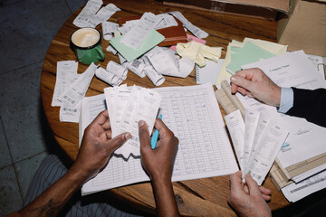 Business Owner Sorting Receipts for Accounting
