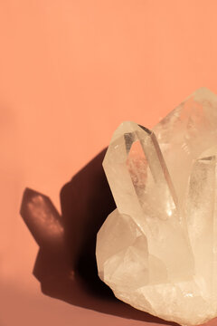 White crystal on peachy fuzz background