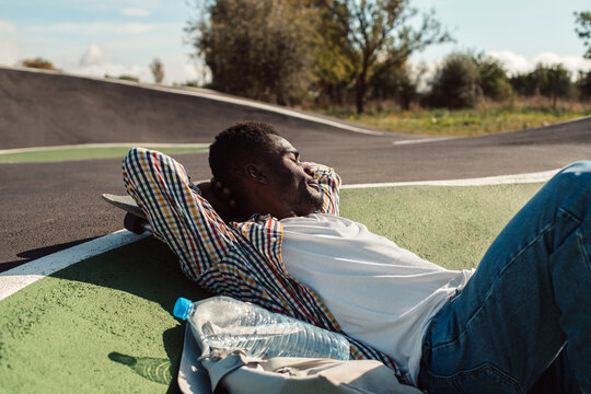Sleepy black man relaxing in the sun