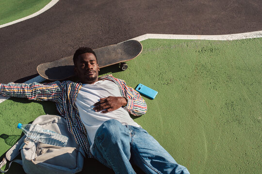 Sleepy black man relaxing in the sun