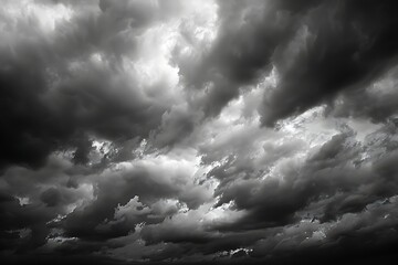 : A dramatic skyscape with dark, brooding clouds foretelling an approaching storm. - obrazy, fototapety, plakaty