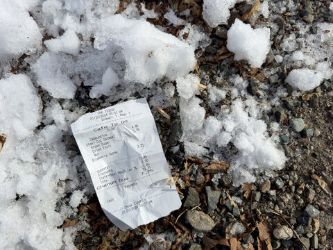 receipt on ground in winter with snow
