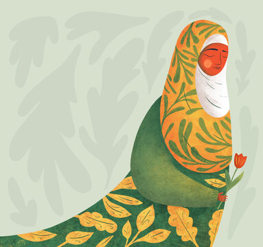 Beautiful muslim woman in hijab with flower