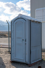 A portable toilet on a jobsite.