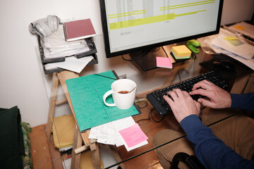 Anonymous hands typing on keyboard