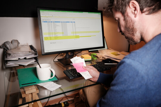 entrepreneur doing accounting for his small business