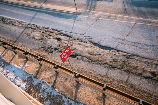 Wrong Way Sign on Snowy Road