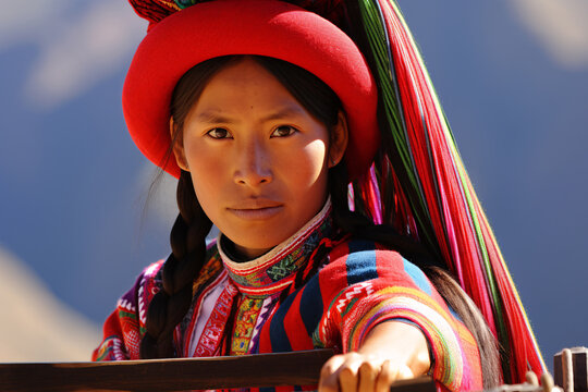 young peruvian woman in traditional clothing looking at camera