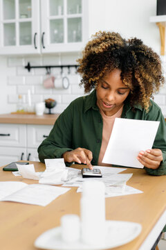 Person counts and pays the receipts.