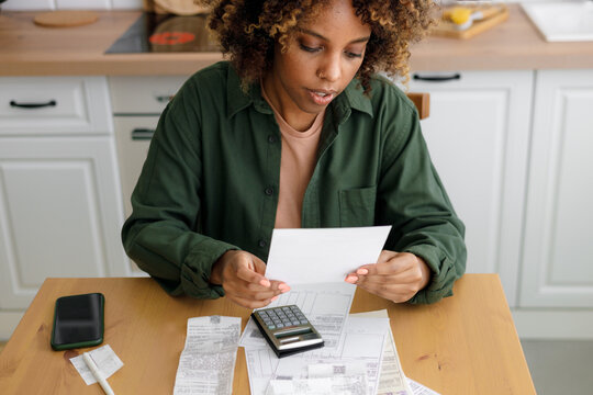 Person counts and pays the receipts.