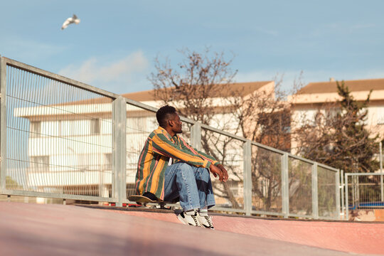 Skateboarder on top of a ramp