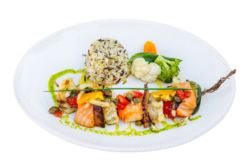 Grilled monkfish and salmon skewers with seasoned vegetables and picante sauce.