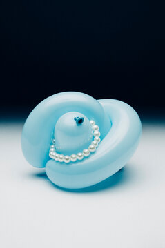 Pearl necklace on blue  balloon