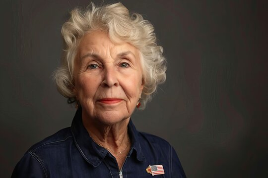 patriotic senior woman wearing american flag pin presidential election voter studio portrait