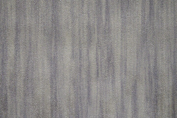 Gray, blue, beige and golden textured wall surface. Rough stylized texture. Abstract decorative background. Old effect background for wallpaper or graphic design.