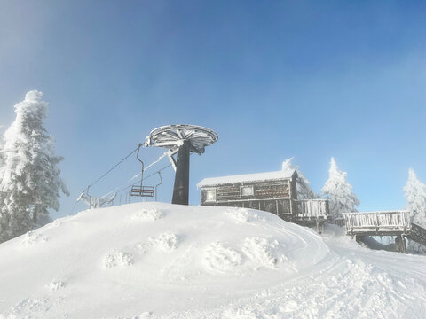 Chair Lift at Old Ski Resort Covered in Snow