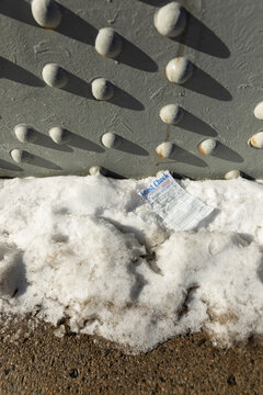  receipt on dirt ground in winter with snow on bridge 