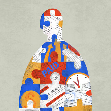 Figure of a business person consisting of puzzle pieces