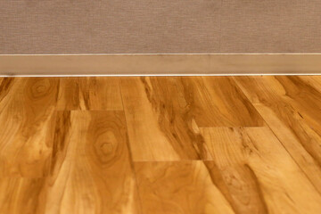 Wooden floor and wall with skirting boards