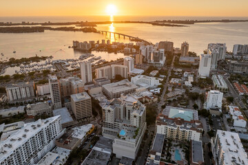 Sarasota, Florida city downtown at sunset with expensive waterfront high-rise buildings. Urban...