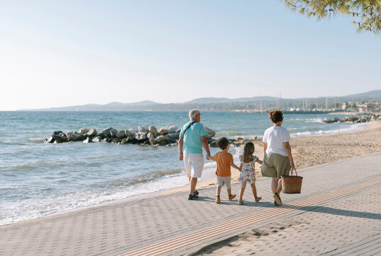 grandparents on a walk with their grandchildren 