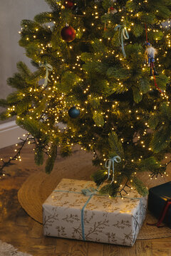 Gift box placed under Christmas tree