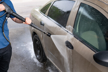 Car wash with high pressure water. Cleaning car with high pressure water.