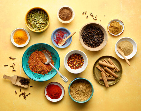 Herbs and Spices on a Yellow background