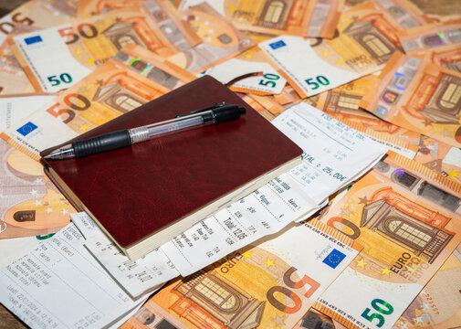 Notebook With Receipts And 50 Euro Bills.