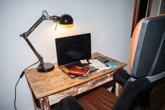 Desk With Receipts, Credit Cards, Notebook And Computer.