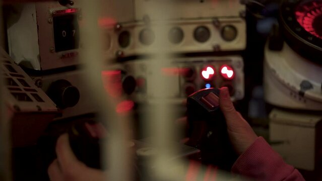 Red button on joystick in tank interior