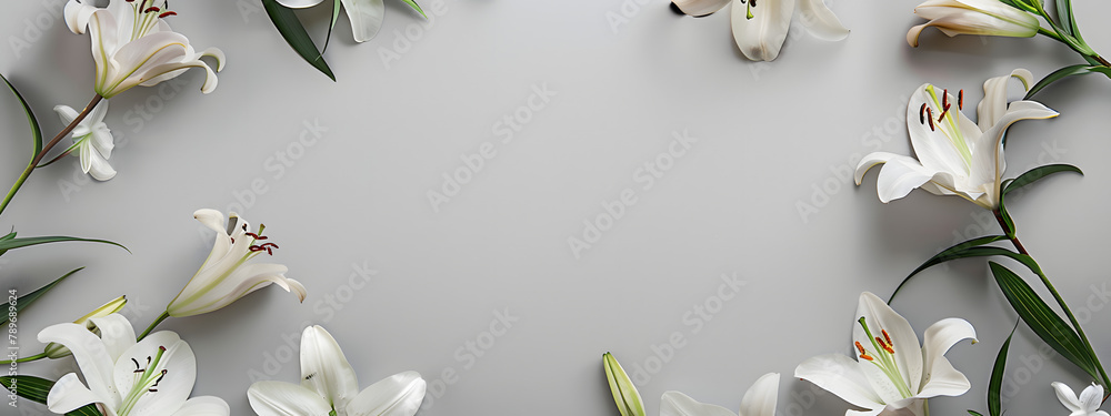 Poster grey lilies border a frame on a grey background with copy space. in a flat lay top view