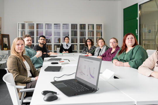 People Listening To The Scientific Presentation 
