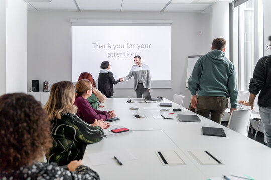 Successful Presentation. Listeners Congratulating The Speaker.