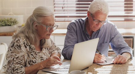 Elderly couple, laptop and kitchen for research, financial budget and online investment for...