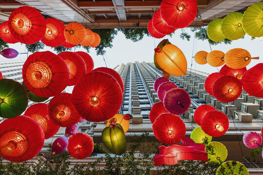 Vibrant Lanterns Against Modern Skyline
