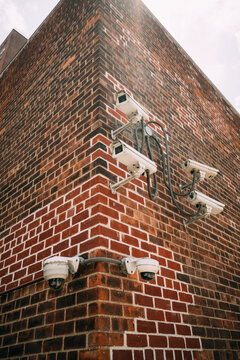 Security Cameras on Brick Wall Corner
