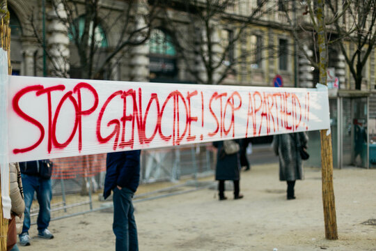 "Stop genocide" words written on an hanging banner in town