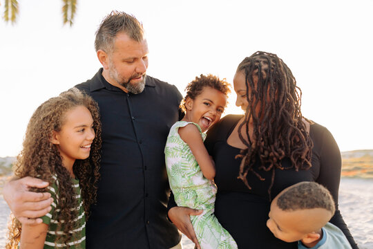 Happy family portrait at the beach