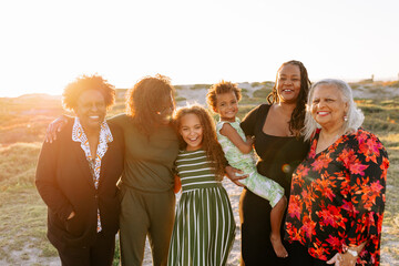Smiling extended family portrait at the beach