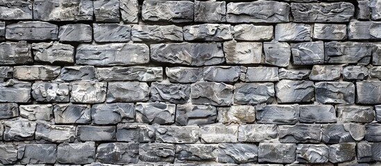 Texture background of an aged gray brick wall