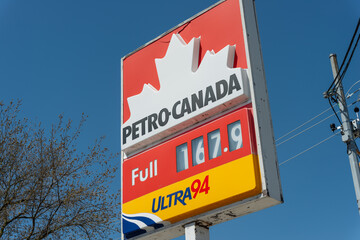 Obraz premium street and price (of fuel) sign close-up at Petro-Canada, a gas station chain, located at 536 Mount Pleasant Road in Toronto, Canada