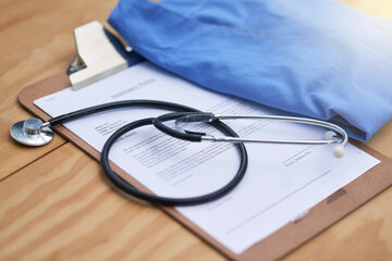 Hospital, clinic and stethoscope with clipboard on desk for medical service, medicine and notes....