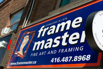 Fototapeta premium exterior sign of Frame Master, a picture frame shop, located at 559 Mount Pleasant Road in Toronto, Canada