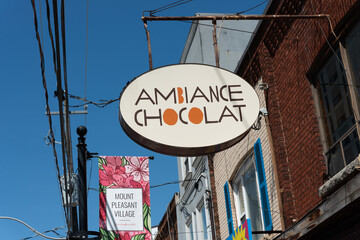 Fototapeta premium vintage projecting sign of Ambiance Chocolat, a chocolate shop, located at 683 Mount Pleasant Road in Toronto, Canada