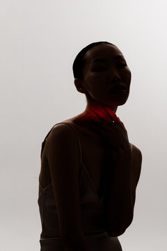 illuminated throat and neck with red light