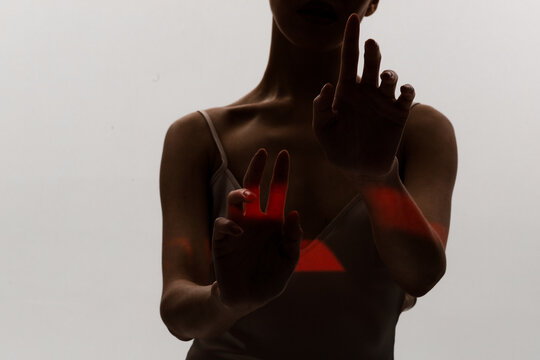 Woman pulls her arms and touching 